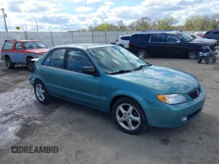 2002 Mazda Protege DX z VIN JM1BJ225721591435, wystawiony jako IAAI lot #42117544 z przebiegiem 191 185 mil mil oraz . Historia ofert i sprzedaży dostępna na DreamBid. Obrazek 1.