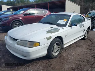 1997 Ford Mustang with VIN 1FALP4040VF200826, listed as a IAAI auction lot 41555969 with 82,134 mi miles. Bid and sale history available at carsss.com. Image 2.