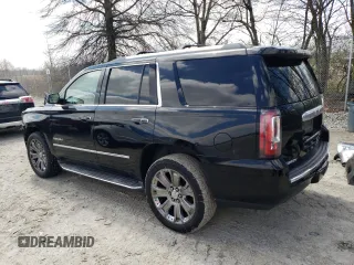 2015 GMC Yukon Denali with VIN 1GKS2CKJXFR702247, listed as a Copart auction lot 51648175 with 151,936 mi miles and Salvage Title. Bid and sale history available at carsss.com. Image 2.