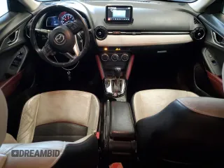 2016 Mazda CX-3 Grand Touring z VIN JM1DKFD74G0137815, wystawiony jako Copart lot #52405765 z przebiegiem 128 922 mil mil oraz Szkoda całkowita • Salvage title. Historia ofert i sprzedaży dostępna na DreamBid. Obrazek 8.