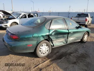 1999 Ford Taurus SE z VIN 1FAFP53U4XA114160, wystawiony jako Copart lot #74946714 z przebiegiem 106 708 mil mil oraz Szkody całkowita. Historia ofert i sprzedaży dostępna na DreamBid. Obrazek 3.
