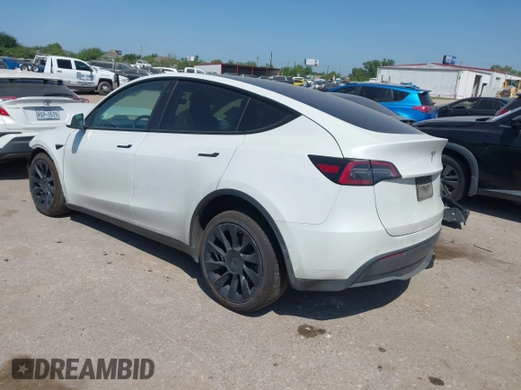 2021 Tesla Model Y Long Range with VIN 5YJYGDEE0MF265339, listed as a IAAI auction lot 41975058 with 51,292 mi miles and . Bid and sale history available at DreamBid. Image 3.