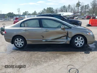 2006 Honda Civic LX with VIN 2HGFA16596H514483, listed as a IAAI auction lot 41889508 with 148,412 mi miles and . Bid and sale history available at DreamBid. Image 13.