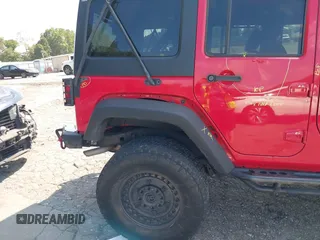 2016 Jeep Wrangler Unlimited Rubicon with VIN 1C4HJWFG7GL128994, listed as a IAAI auction lot 40503403 with 85,950 mi miles. Bid and sale history available at carsss.com. Image 17.