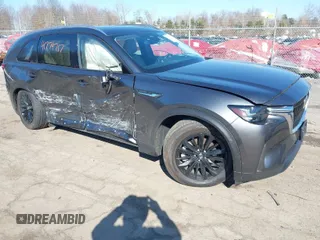 2024 Mazda CX-90 Preferred z VIN JM3KKBHA8R1180077, wystawiony jako IAAI lot #41774717 z przebiegiem 10 992 mil mil oraz . Historia ofert i sprzedaży dostępna na DreamBid. Obrazek 1.
