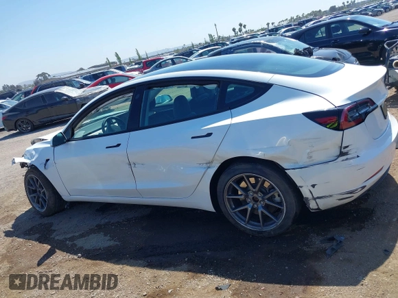 2023 Tesla Model 3 with VIN 5YJ3E1EA2PF571569, listed as a IAAI auction lot 42288715 with 30,271 mi miles and . Bid and sale history available at DreamBid. Image 14.