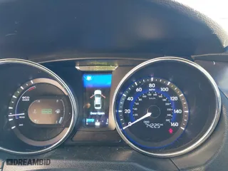 2014 Hyundai Sonata Hybrid with VIN KMHEC4A42EA117405, listed as a IAAI auction lot 41157185 with 74,225 mi miles. Bid and sale history available at carsss.com. Image 7.