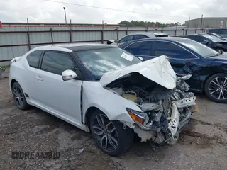 2014 Scion tC with VIN JTKJF5C7XE3073500, listed as a IAAI auction lot 41100111 with 1 mi miles. Bid and sale history available at carsss.com. Image 1.