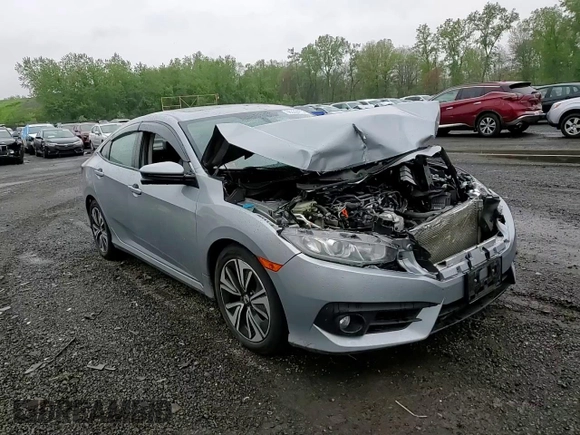 2017 Honda Civic EX-L z VIN 19XFC1F74HE209787, wystawiony jako Copart lot #56352415 z przebiegiem 130 264 mil mil oraz Szkoda całkowita • Salvage title. Historia ofert i sprzedaży dostępna na DreamBid. Obrazek 14.