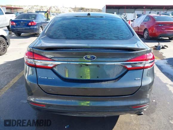 2018 Ford Fusion SE z VIN 3FA6P0H70JR191384, wystawiony jako IAAI lot #41340319 z przebiegiem 89 581 mil mil oraz . Historia ofert i sprzedaży dostępna na DreamBid. Obrazek 16.