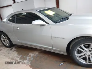2014 Chevrolet Camaro LS z VIN 2G1FA1E36E9212973, wystawiony jako IAAI lot #41956457 z przebiegiem 159 370 mil mil oraz . Historia ofert i sprzedaży dostępna na DreamBid. Obrazek 13.