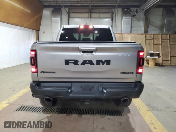 2022 Ram 1500 Rebel z VIN 1C6SRFLT1NN258780, wystawiony jako Copart lot #53040405 z przebiegiem 27 307 mil mil oraz Szkoda całkowita • Salvage title. Historia ofert i sprzedaży dostępna na DreamBid. Obrazek 6.