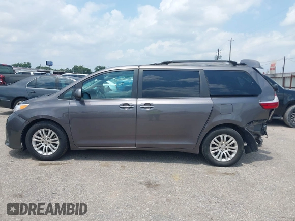 2015 Toyota Sienna XLE with VIN 5TDYK3DCXFS688971, listed as a IAAI auction lot 42127912 with 143,024 mi miles. Bid and sale history available at carsss.com. Image 14.