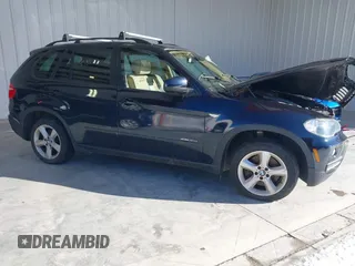 2010 BMW X5 35d with VIN 5UXFF0C50ALJ99887, listed as a IAAI auction lot 41585772 with 96,983 mi miles. Bid and sale history available at carsss.com. Image 1.
