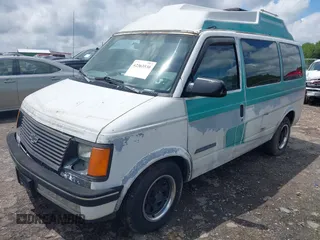 1991 Chevrolet Astro Cargo z VIN 1GBDM19Z7MB202913, wystawiony jako IAAI lot #42363530 z przebiegiem 191 695 mil mil oraz . Historia ofert i sprzedaży dostępna na DreamBid. Obrazek 2.
