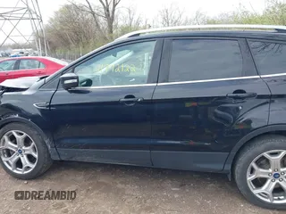 2019 Ford Escape Titanium with VIN 1FMCU9J91KUC42161, listed as a IAAI auction lot 41942122 with 100,677 mi miles and . Bid and sale history available at DreamBid. Image 14.