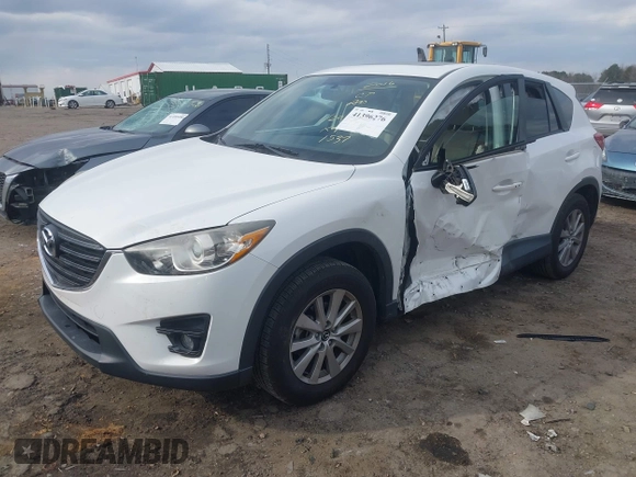 2016 Mazda CX-5 Touring with VIN JM3KE2CY5G0791537, listed as a IAAI auction lot 41396276 with 42,095 mi miles. Bid and sale history available at carsss.com. Image 18.