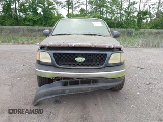 2001 Ford F-150 XL z VIN 1FTRX17L21NA34986, wystawiony jako IAAI lot #42334380 z przebiegiem Nie podano mil oraz . Historia ofert i sprzedaży dostępna na DreamBid. Obrazek 6.
