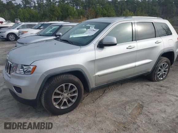 2012 Jeep Grand Cherokee Laredo with VIN 1C4RJFAG7CC189381, listed as a IAAI auction lot 41429085 with 137,238 mi miles. Bid and sale history available at carsss.com. Image 2.