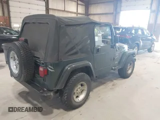 2000 Jeep Wrangler Sport with VIN 1J4FA49S2YP712526, listed as a IAAI auction lot 42151725 with 99,416 mi miles. Bid and sale history available at carsss.com. Image 4.