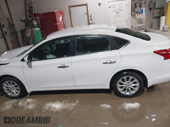 2019 Nissan Sentra S z VIN 3N1AB7APXKY240431, wystawiony jako IAAI lot #41722182 z przebiegiem 81 450 mil mil oraz . Historia ofert i sprzedaży dostępna na DreamBid. Obrazek 14.