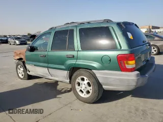 1999 Jeep Grand Cherokee Laredo with VIN 1J4G258S0XC561054, listed as a Copart auction lot 49814555 with Not provided miles and Salvage title. Bid and sale history available at DreamBid. Image 2.