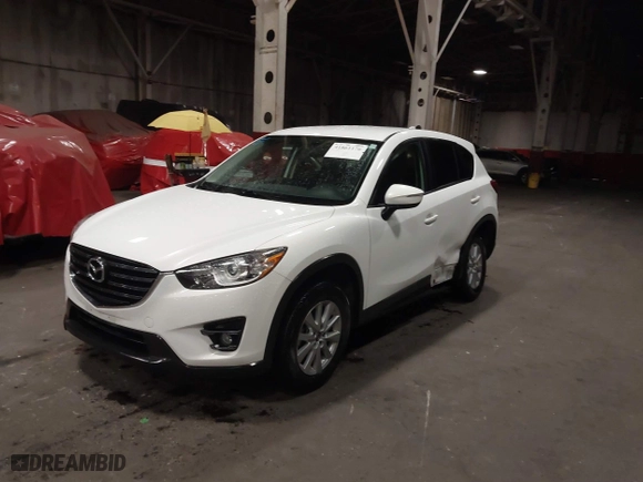 2016 Mazda CX-5 Touring with VIN JM3KE4CY0G0853261, listed as a IAAI auction lot 41861176 with 63,491 mi miles. Bid and sale history available at carsss.com. Image 17.