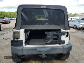 2010 Jeep Wrangler Unlimited Rubicon with VIN 1J4BA6H10AL176014, listed as a Copart auction lot 57092255 with 138,253 mi miles and Salvage title. Bid and sale history available at DreamBid. Image 6.