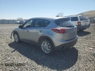2015 Mazda CX-5 Grand Touring with VIN JM3KE4DY5F0540655, listed as a Copart auction lot 52893155 with 152,279 mi miles and Salvage Title. Bid and sale history available at carsss.com. Image 2.