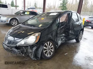2013 Honda Fit Sport with VIN JHMGE8H57DC033384, listed as a IAAI auction lot 41871356 with 150,777 mi miles. Bid and sale history available at carsss.com. Image 2.