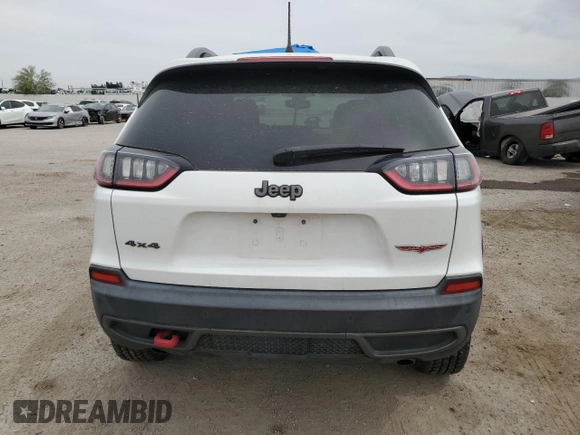 2020 Jeep Cherokee Trailhawk with VIN 1C4PJMBX9LD504136, listed as a Copart auction lot 58975865 with 79,515 mi miles and Salvage title. Bid and sale history available at DreamBid. Image 6.