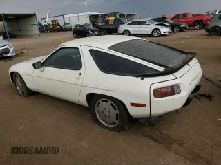 1984 Porsche 928 z VIN WP0JB0921ES860293, wystawiony jako Copart lot #70132694 z przebiegiem 134 907 mil mil oraz Tytuł czysty. Historia ofert i sprzedaży dostępna na DreamBid. Obrazek 2.