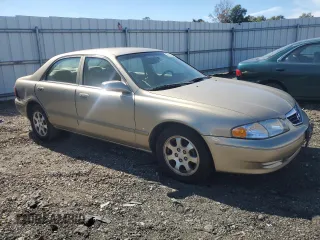 2001 Mazda 626 LX with VIN 1YVGF22C815231985, listed as a Copart auction lot 74913884 with 52,699 mi miles and Clean Title. Bid and sale history available at carsss.com. Image 4.
