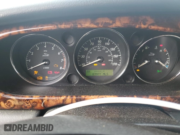 2004 Jaguar XJ with VIN SAJEA71C54SG01455, listed as a Copart auction lot 86591014 with 83,977 mi miles and Salvage Title. Bid and sale history available at carsss.com. Image 9.