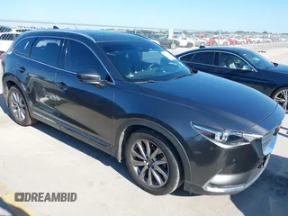2020 Mazda CX-9 Grand Touring with VIN JM3TCADY1L0417651, listed as a IAAI auction lot 42334867 with 105,236 mi miles and . Bid and sale history available at DreamBid. Image 1.