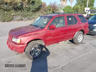 2001 Isuzu Rodeo S with VIN 4S2DM58W814303358, listed as a IAAI auction lot 42695509 with Not provided miles and . Bid and sale history available at DreamBid. Image 2.