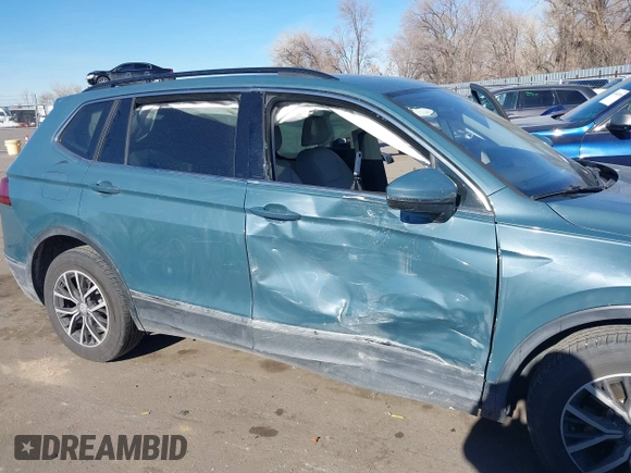 2021 Volkswagen Tiguan SE with VIN 3VV2B7AXXMM089913, listed as a IAAI auction lot 41402158 with 68,158 mi miles and . Bid and sale history available at DreamBid. Image 6.