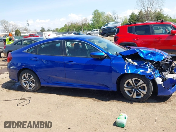 2018 Honda Civic LX with VIN 19XFC2F53JE020297, listed as a IAAI auction lot 42114807 with 124,058 mi miles and . Bid and sale history available at carsss.com. Image 13.