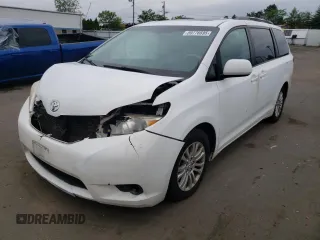 2011 Toyota Sienna XLE AAS with VIN 5TDYK3DCXBS063948, listed as a Copart auction lot 59776695 with 305,799 mi miles and Salvage title. Bid and sale history available at DreamBid. Image 1.