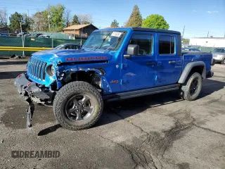 2020 Jeep Gladiator Rubicon z VIN 1C6JJTBGXLL179073, wystawiony jako Copart lot #57136655 z przebiegiem 35 849 mil mil oraz Szkoda całkowita • Salvage title. Historia ofert i sprzedaży dostępna na DreamBid. Obrazek 1.