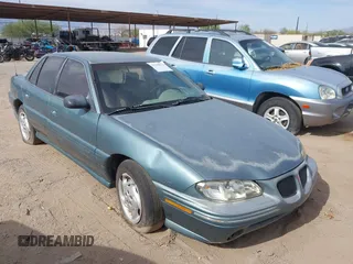 1996 Pontiac Grand Am SE z VIN 1G2NE52M8TC810732, wystawiony jako IAAI lot #42338979 z przebiegiem 107 027 mil mil oraz . Historia ofert i sprzedaży dostępna na DreamBid. Obrazek 1.