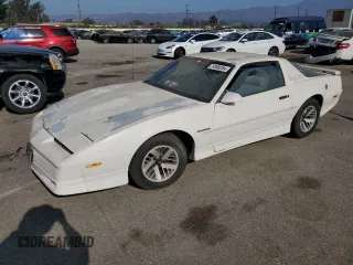 1989 Pontiac Firebird z VIN 1G2FS21S5KL248380, wystawiony jako Copart lot #74590284 z przebiegiem 189 808 mil mil oraz Szkoda całkowita • Salvage title. Historia ofert i sprzedaży dostępna na DreamBid. Obrazek 1.
