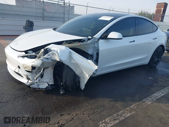 2021 Tesla Model 3 Long Range with VIN 5YJ3E1EB0MF009965, listed as a IAAI auction lot 41478233 with 31,713 mi miles and . Bid and sale history available at DreamBid. Image 2.