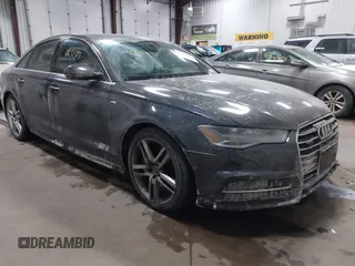 2016 Audi A6 Premium Plus z VIN WAUGFAFCXGN104249, wystawiony jako IAAI lot #41631393 z przebiegiem 117 516 mil mil oraz . Historia ofert i sprzedaży dostępna na DreamBid. Obrazek 1.