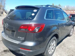 2015 Mazda CX-9 Touring with VIN JM3TB3CV1F0461854, listed as a IAAI auction lot 42068299 with 128,124 mi miles. Bid and sale history available at carsss.com. Image 4.