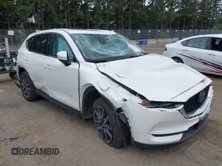 2018 Mazda CX-5 Grand Touring with VIN JM3KFBDM1J0382306, listed as a IAAI auction lot 42554947 with 121,303 mi miles and . Bid and sale history available at DreamBid. Image 1.