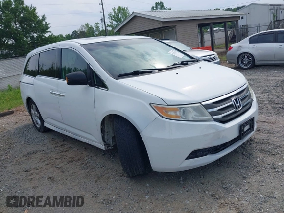 2011 Honda Odyssey Touring with VIN 5FNRL5H90BB066177, listed as a IAAI auction lot 42053368 with 239,205 mi miles and . Bid and sale history available at DreamBid. Image 1.