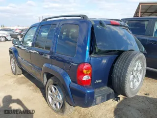2004 Jeep Liberty Limited with VIN 1J4GK58KX4W110899, listed as a IAAI auction lot 41544199 with 242,501 mi miles. Bid and sale history available at carsss.com. Image 3.
