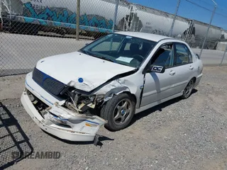 2002 Mitsubishi Lancer OZ-Rally with VIN JA3AJ86E42U039140, listed as a IAAI auction lot 41853888 with 328,181 mi miles. Bid and sale history available at carsss.com. Image 2.