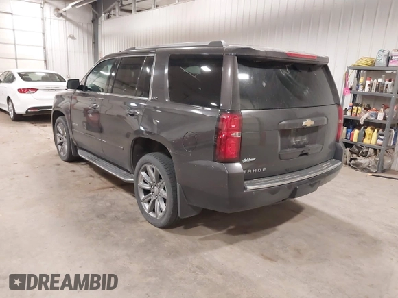 2016 Chevrolet Tahoe LTZ with VIN 1GNSKCKC1GR201155, listed as a IAAI auction lot 42235228 with 184,585 mi miles and . Bid and sale history available at DreamBid. Image 3.